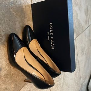 Navy Cole Haan pumps.